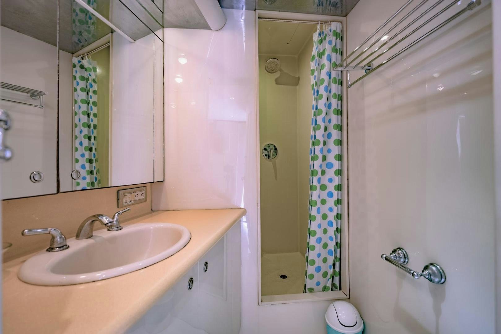 a bathroom with a sink and a mirror aboard DOUBLEYOU Yacht for Sale