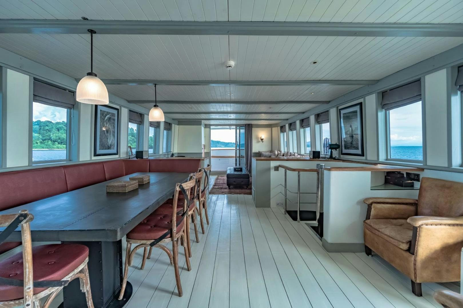 a large kitchen with a table and chairs aboard DOUBLEYOU Yacht for Sale