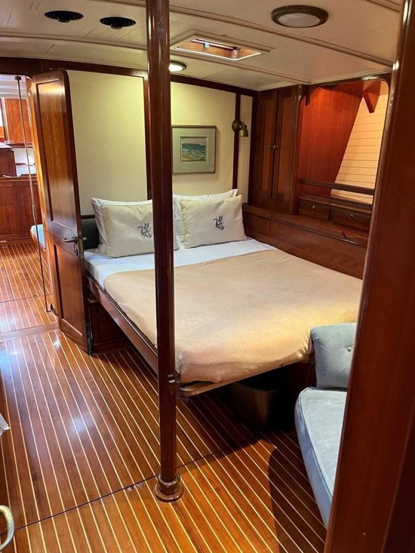 a bed in a room aboard VOLTERRA Yacht for Sale