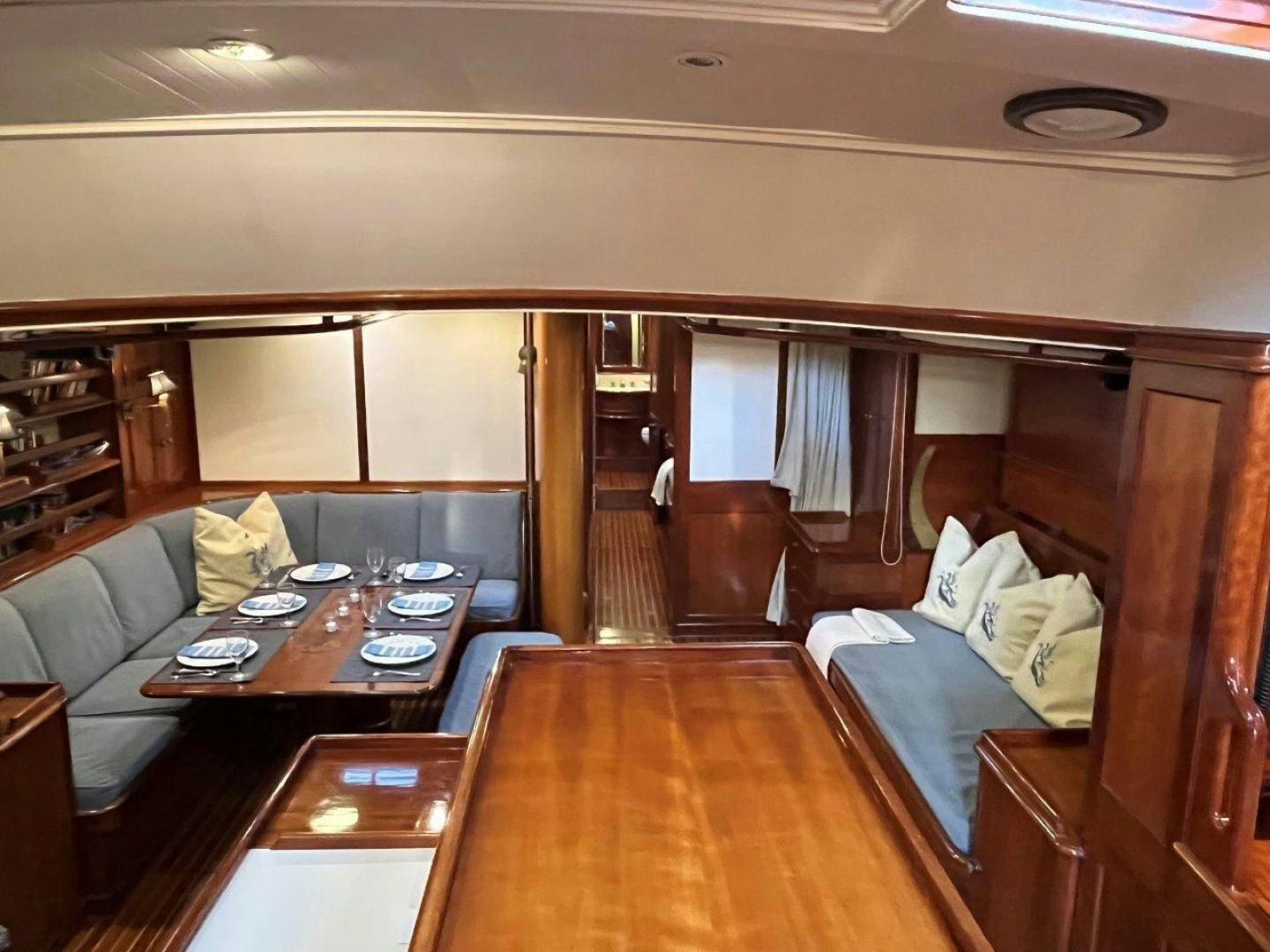 a living room with a couch and a coffee table aboard VOLTERRA Yacht for Sale