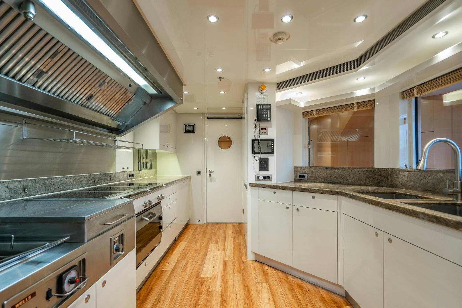 a kitchen with a large island aboard SOUTH Yacht for Sale
