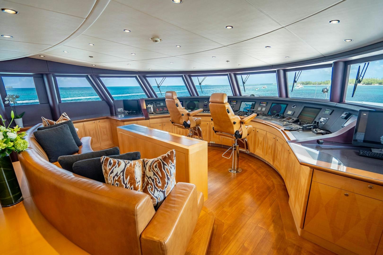 a room with a couch and a desk and a computer aboard SOUTH Yacht for Sale