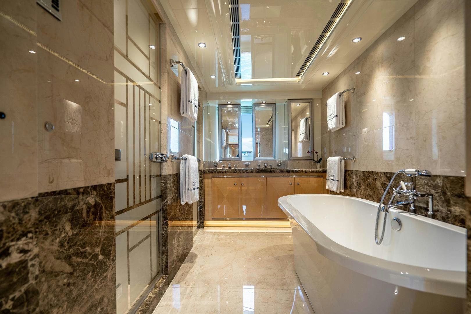 a bathroom with a large marble countertop aboard SOUTH Yacht for Sale