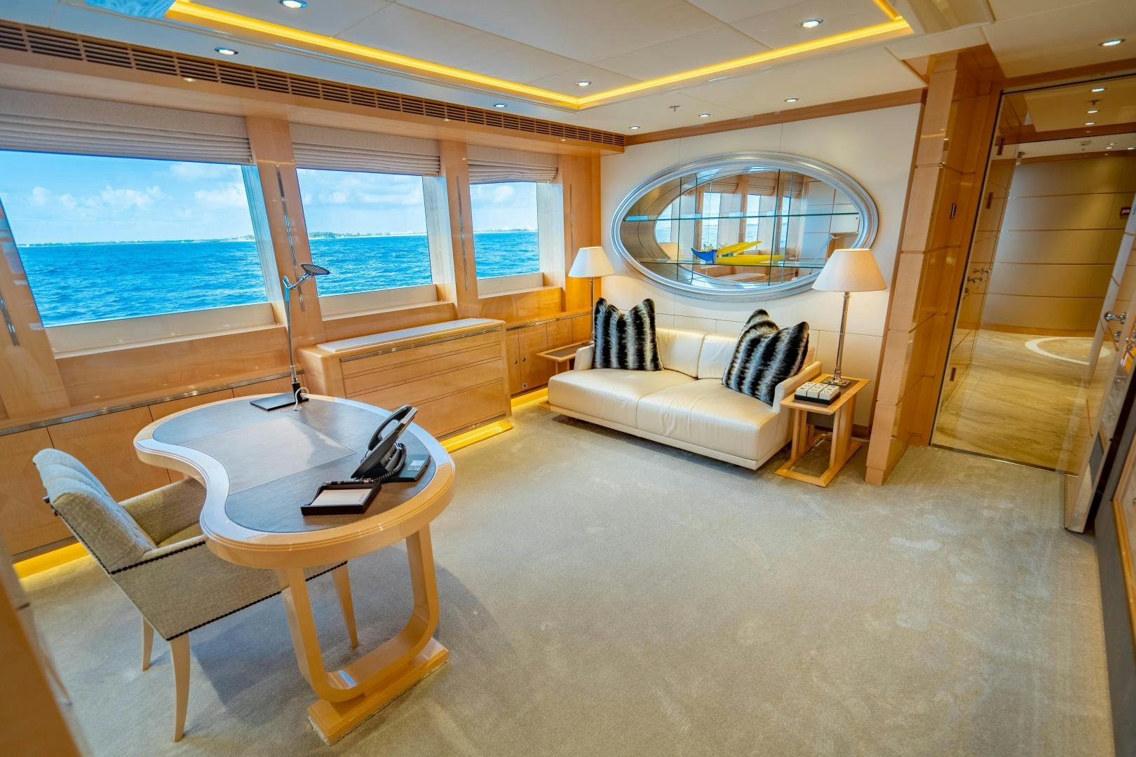 a room with a bed and a table aboard SOUTH Yacht for Sale