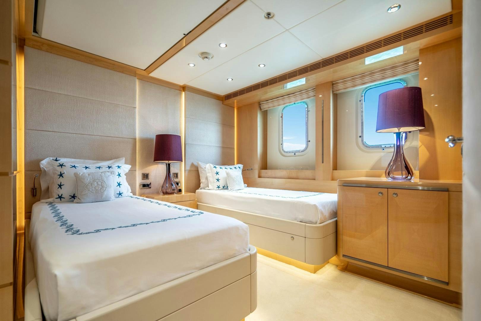 a couple of beds in a hotel room aboard SOUTH Yacht for Sale