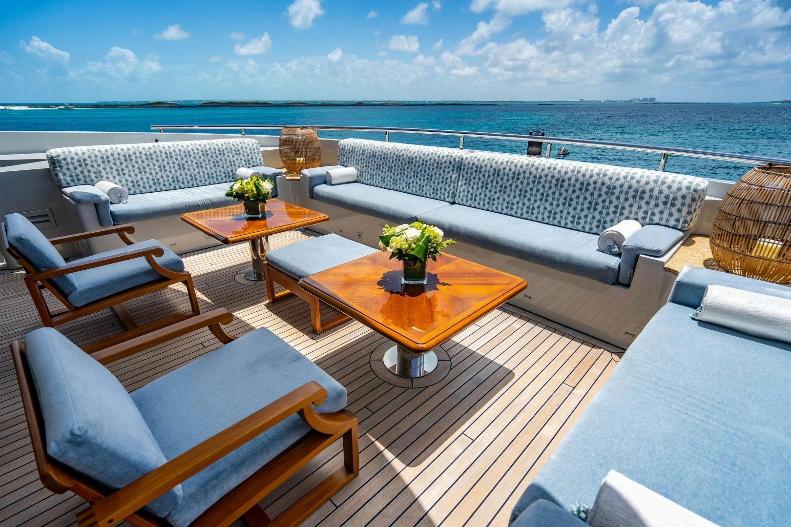a room with a table chairs and a view of the ocean aboard SOUTH Yacht for Sale