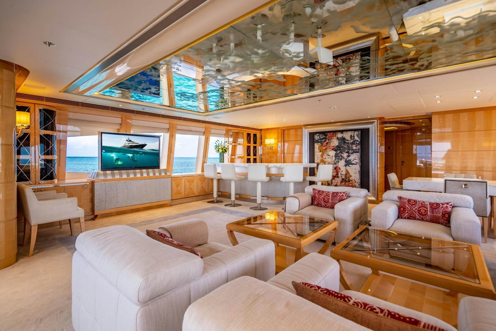a living room with a large window aboard SOUTH Yacht for Sale