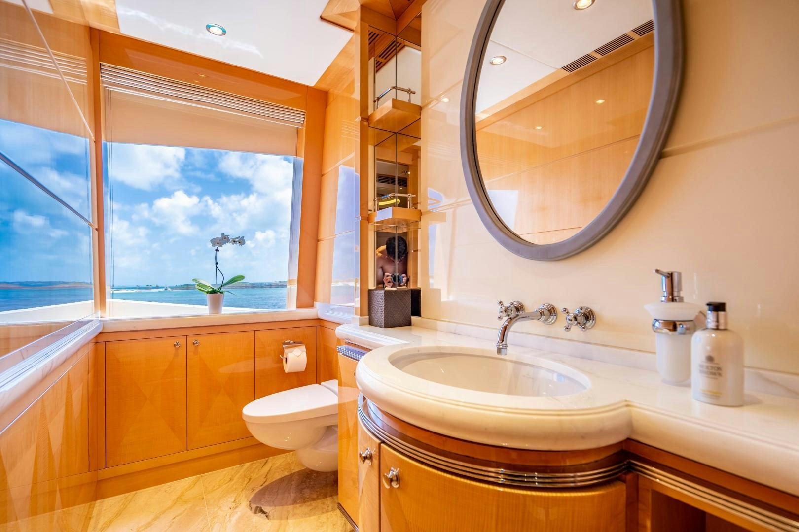 a bathroom with a large mirror aboard SOUTH Yacht for Sale