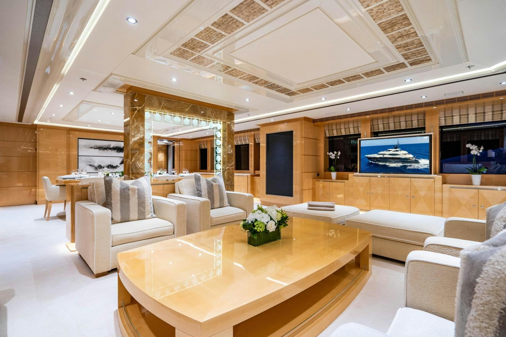 a large room with a table and chairs aboard SOUTH Yacht for Sale