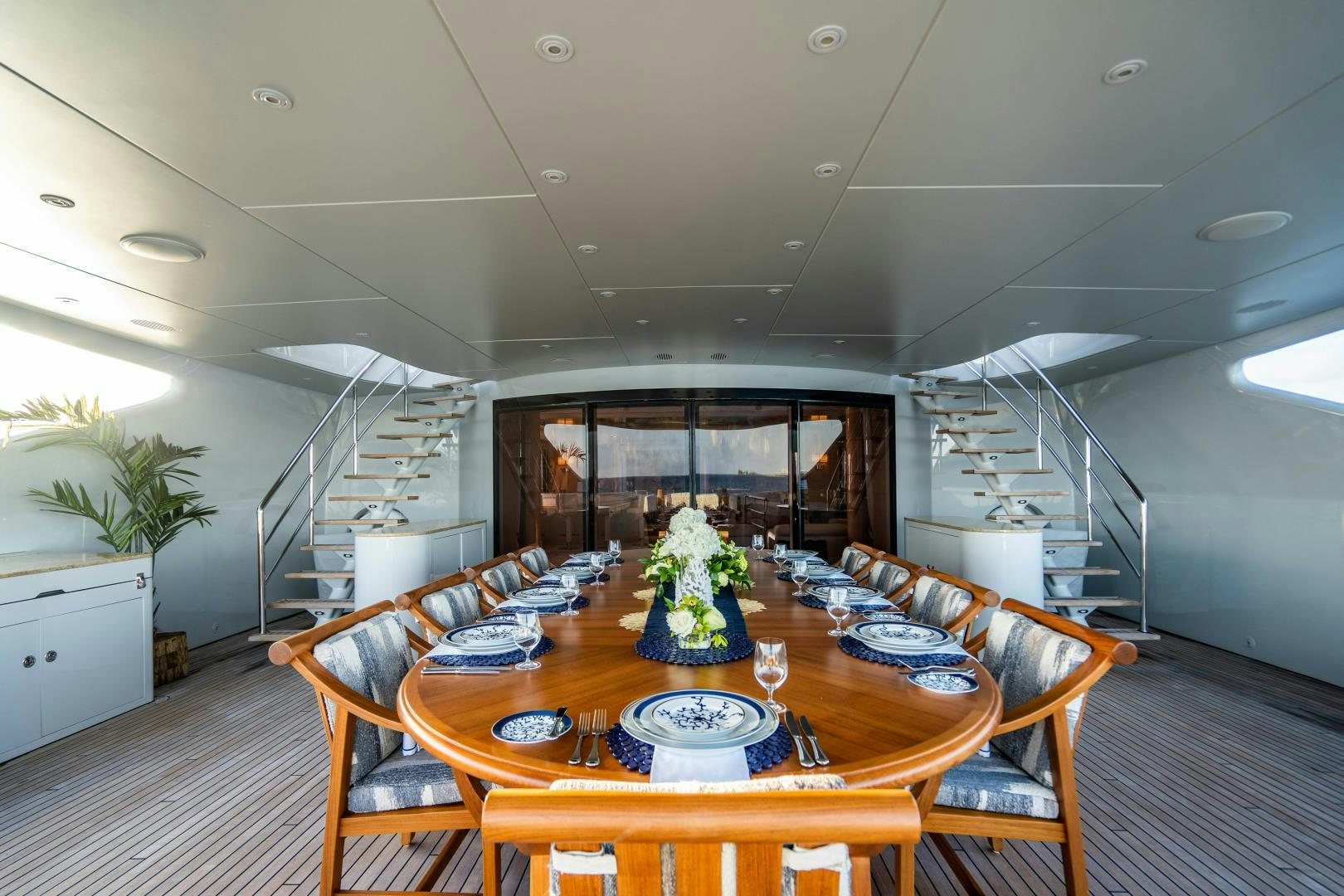 a large dining room with a large table and chairs aboard SOUTH Yacht for Sale
