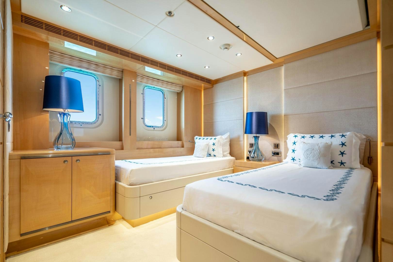 a room with two beds aboard SOUTH Yacht for Sale