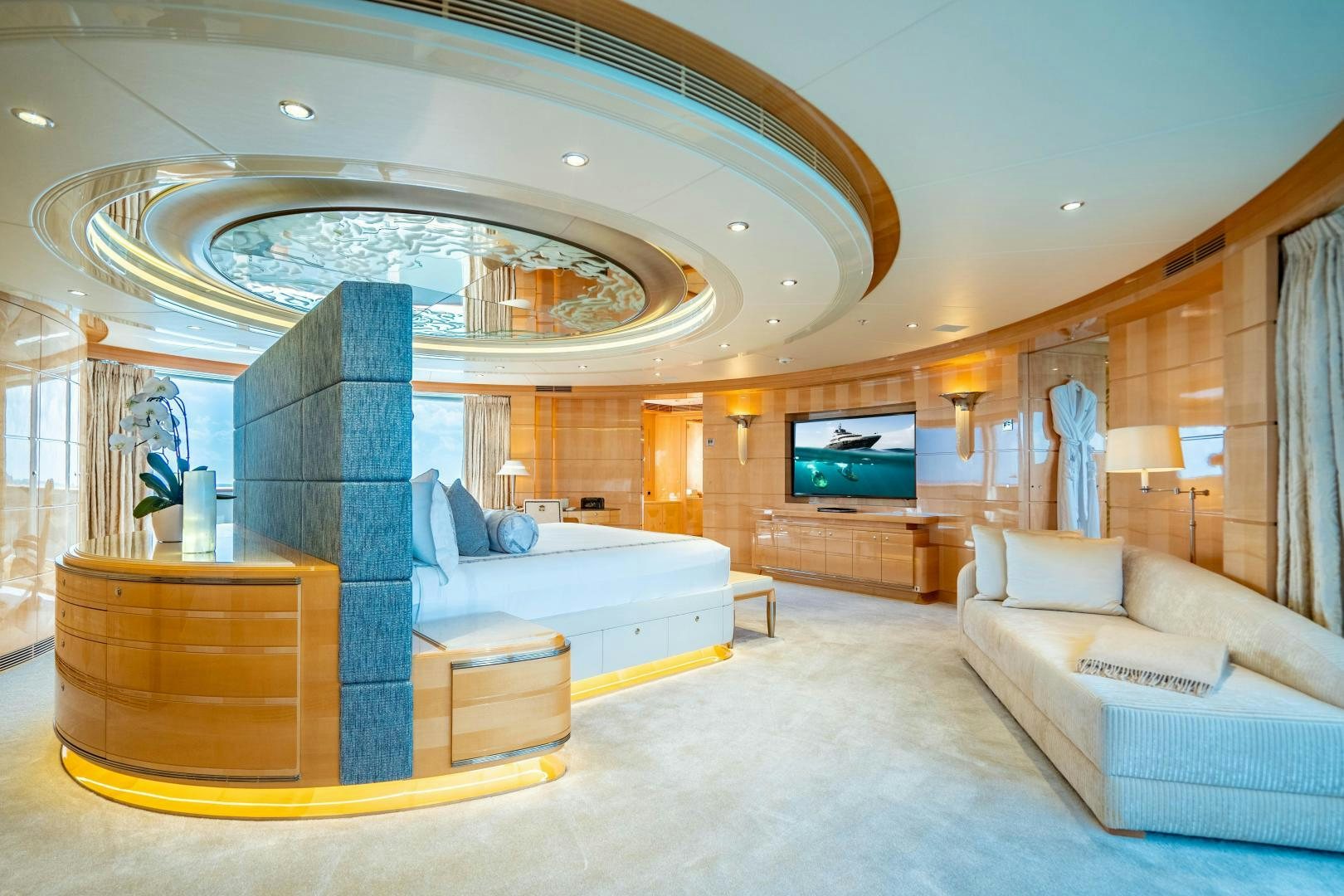 a living room with a large mirror aboard SOUTH Yacht for Sale