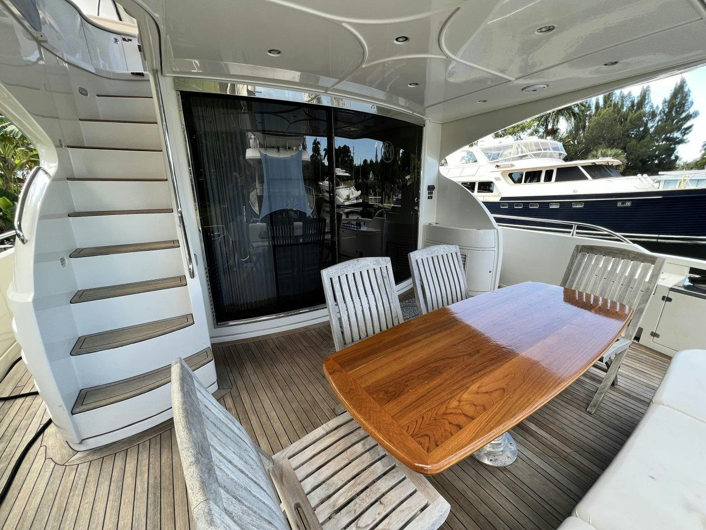 a table and chairs on a deck aboard Casablanca II Yacht for Sale