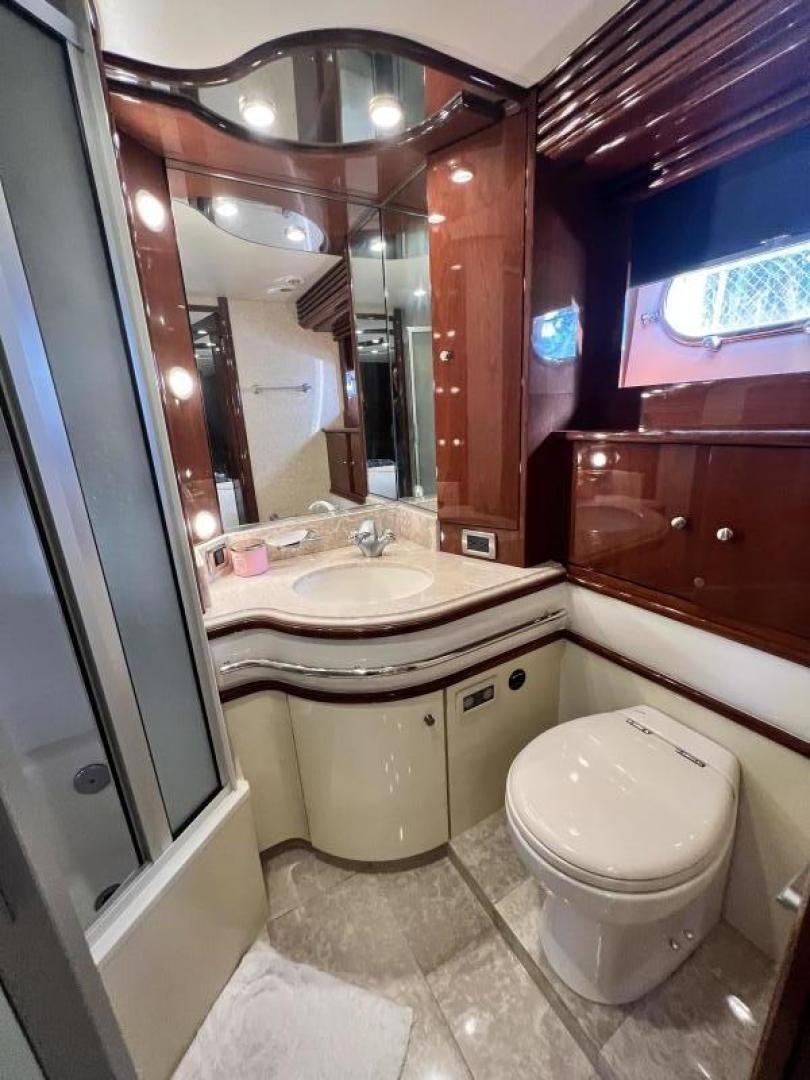 a bathroom with a toilet and a sink aboard Casablanca II Yacht for Sale