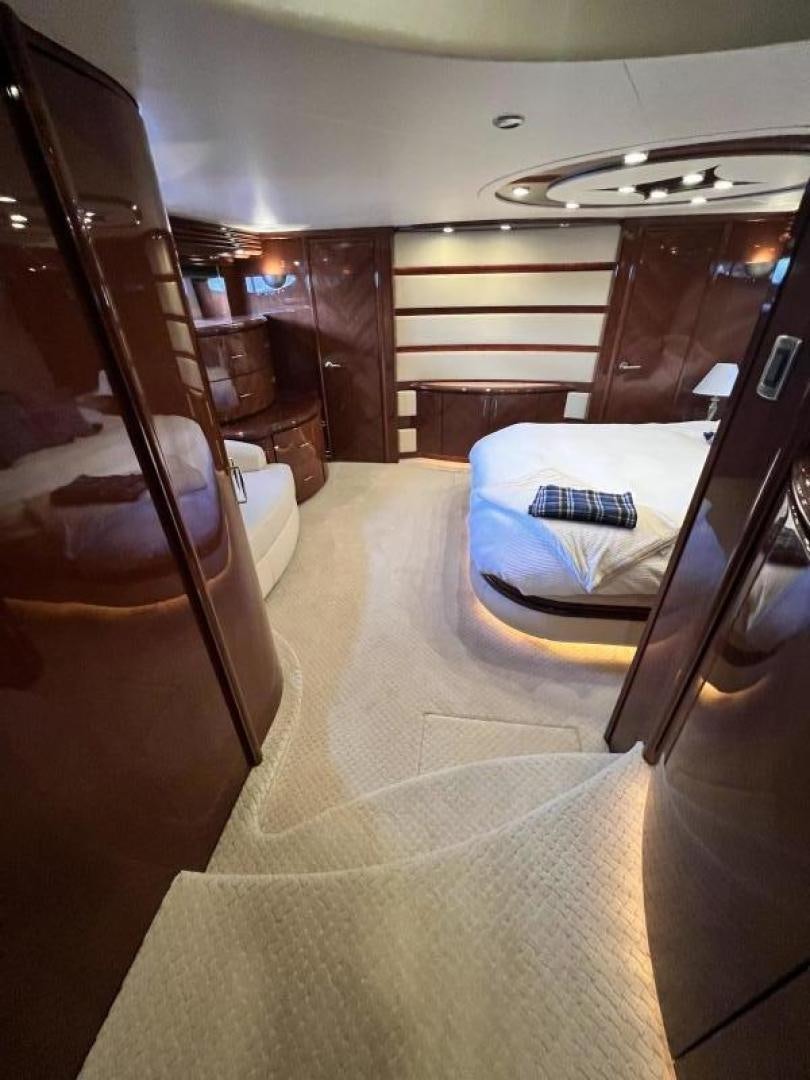 a room with a bed and a couch aboard Casablanca II Yacht for Sale