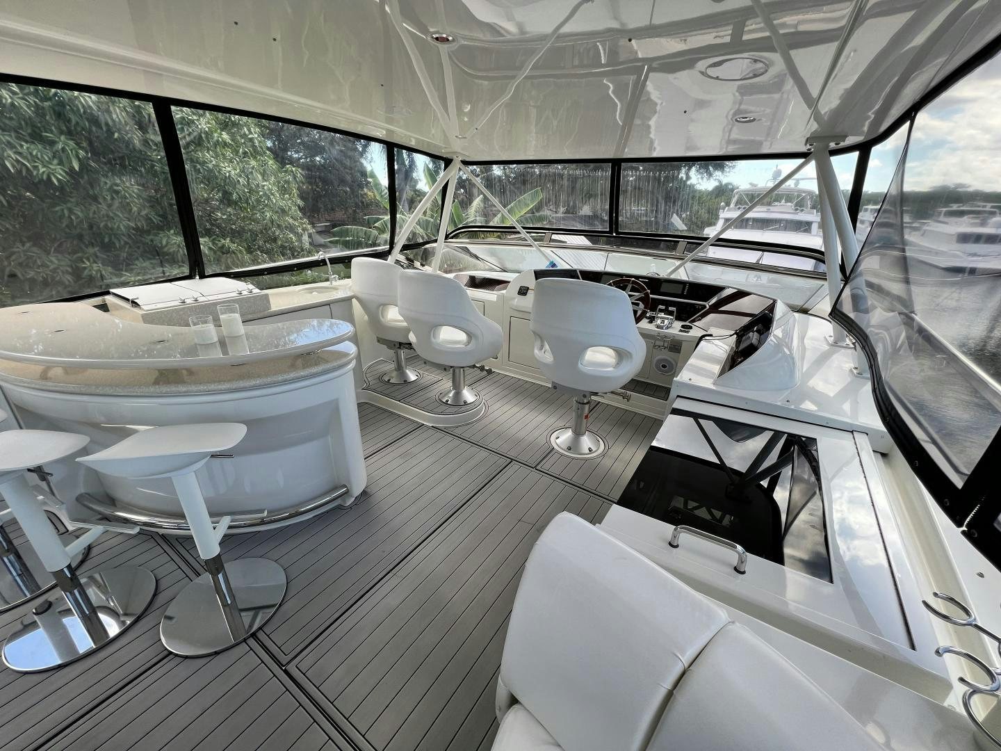 inside of a vehicle with tables and chairs aboard Casablanca II Yacht for Sale