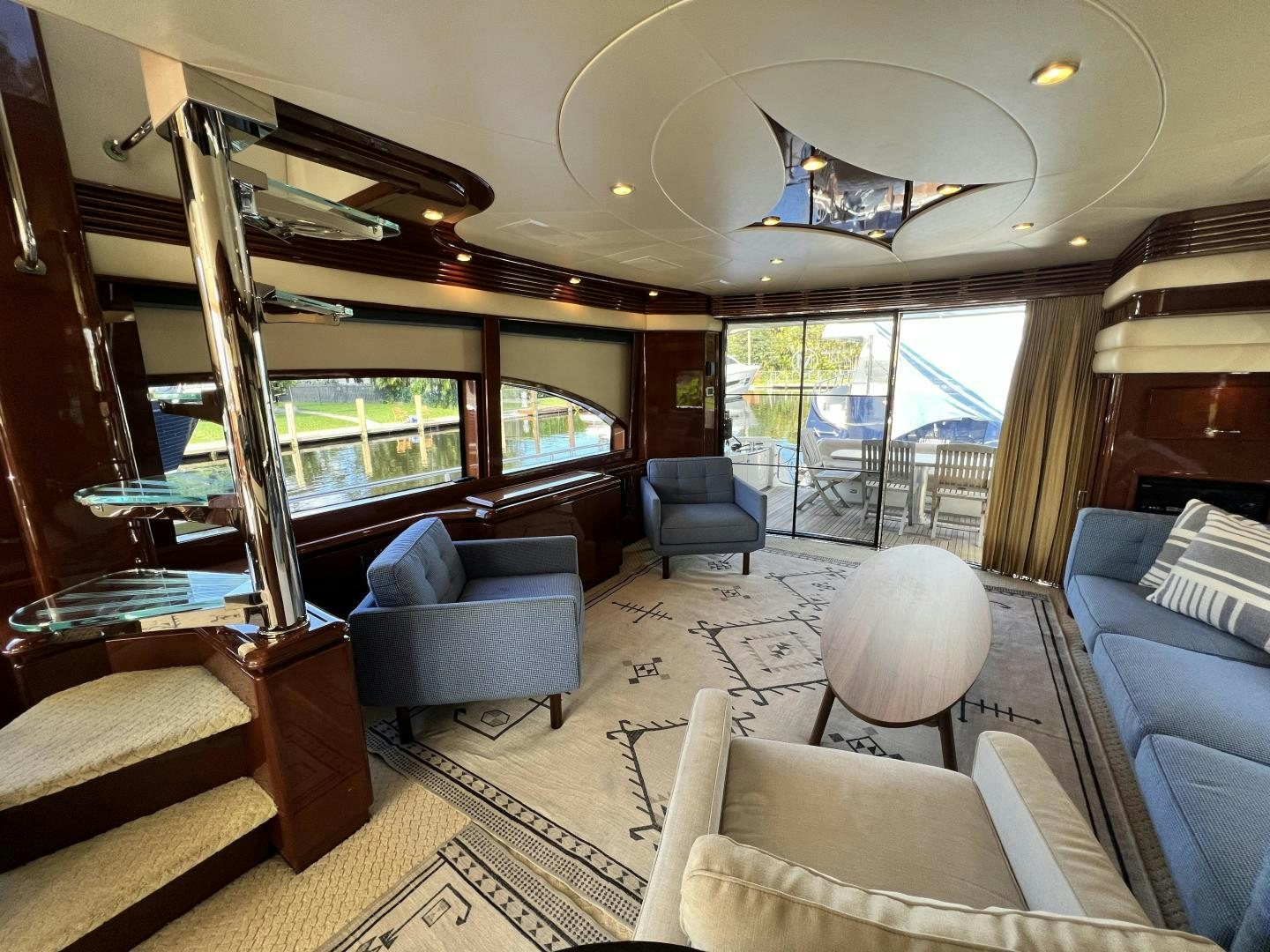 a large living room with a large glass window aboard Casablanca II Yacht for Sale