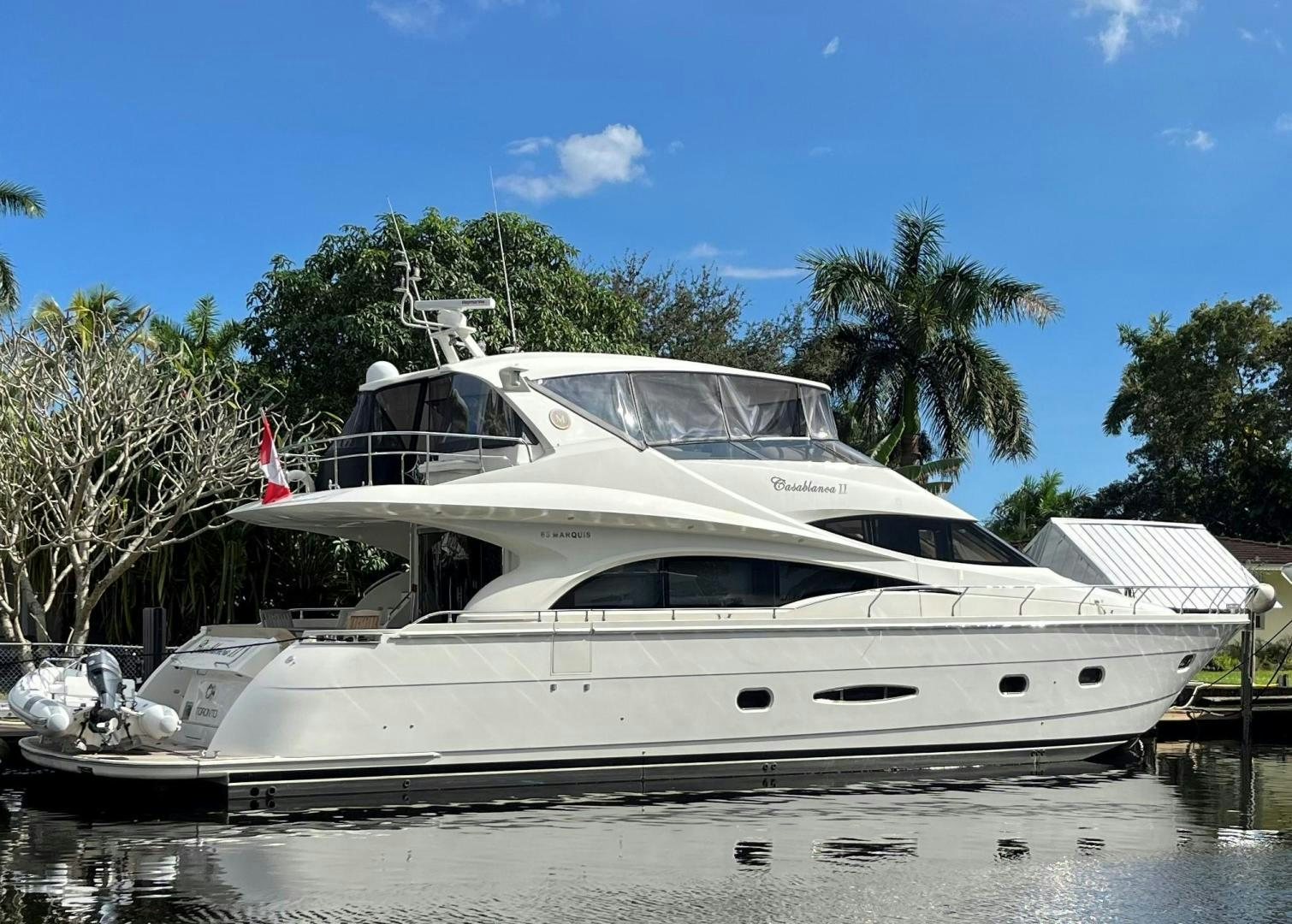 a white yacht docked aboard Casablanca II Yacht for Sale