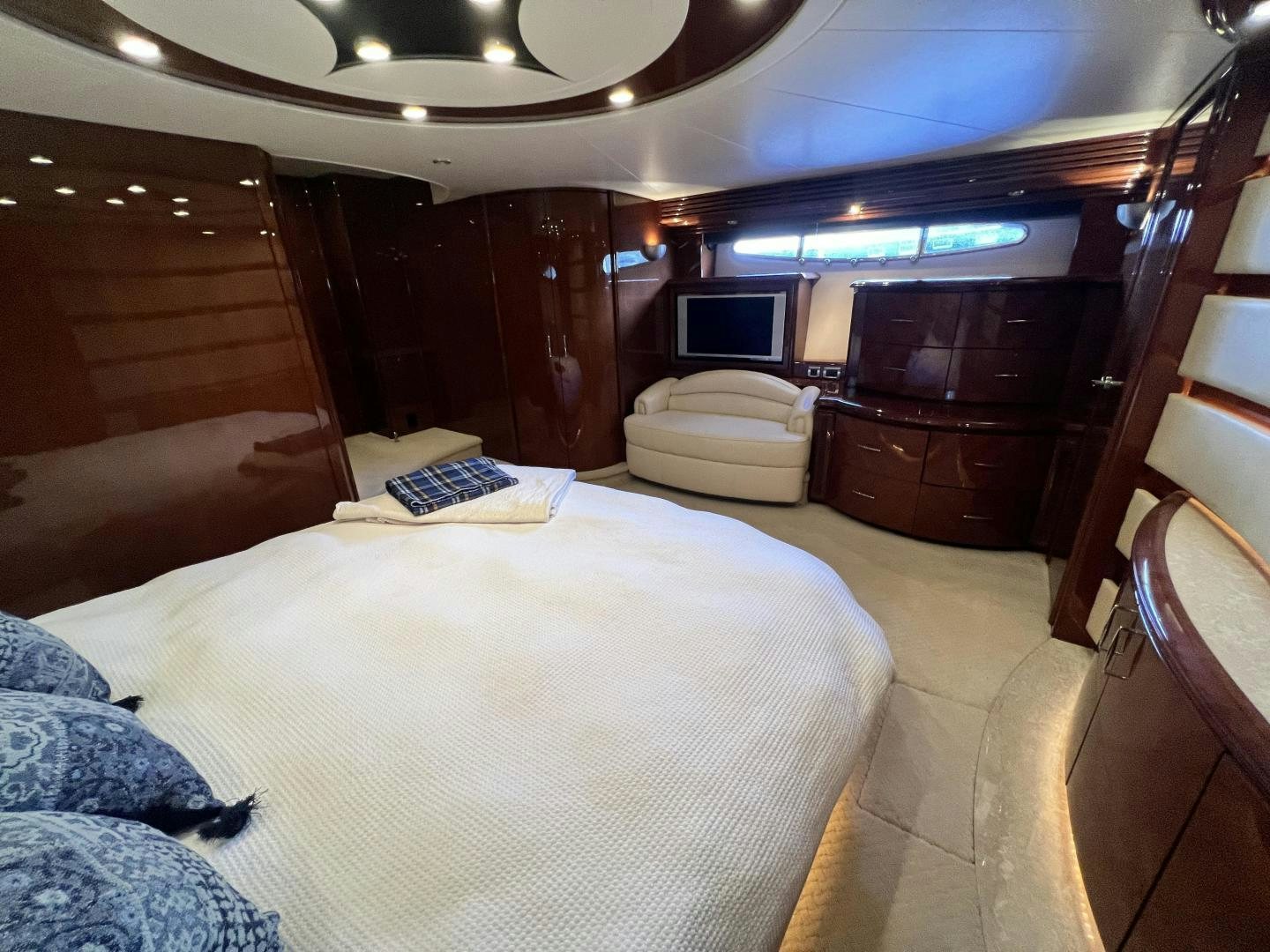 a room with a bed and a desk aboard Casablanca II Yacht for Sale