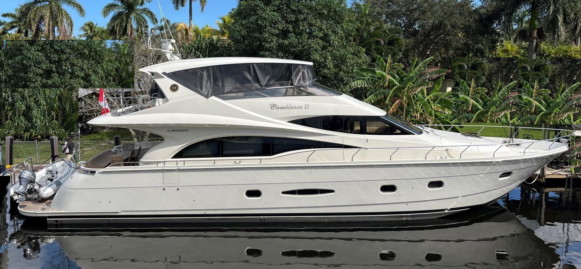 a white yacht parked in a dock aboard Casablanca II Yacht for Sale