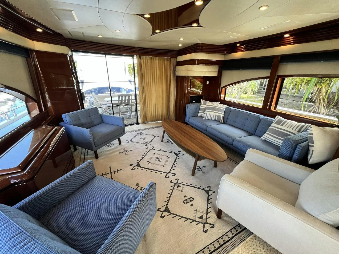 a living room with a couch and a table aboard Casablanca II Yacht for Sale