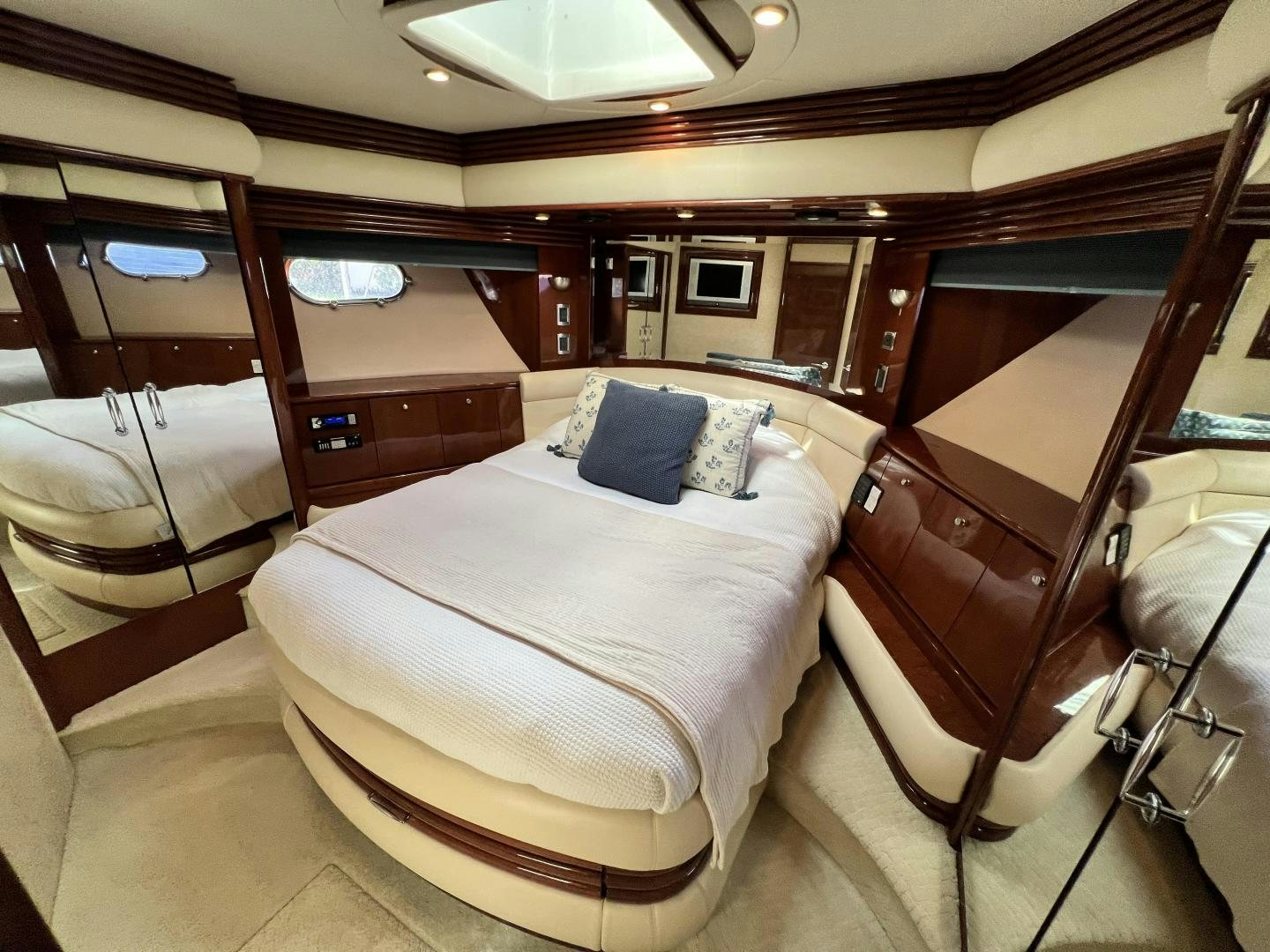a room with a bed and a chair aboard Casablanca II Yacht for Sale
