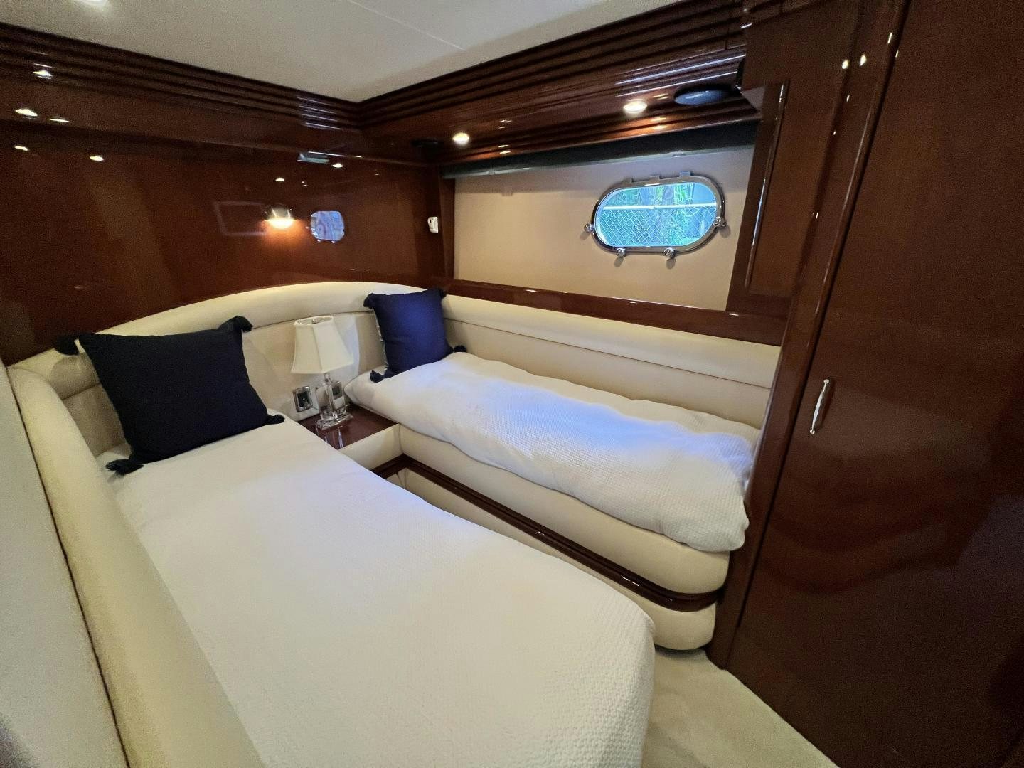 a room with a couple of beds aboard Casablanca II Yacht for Sale