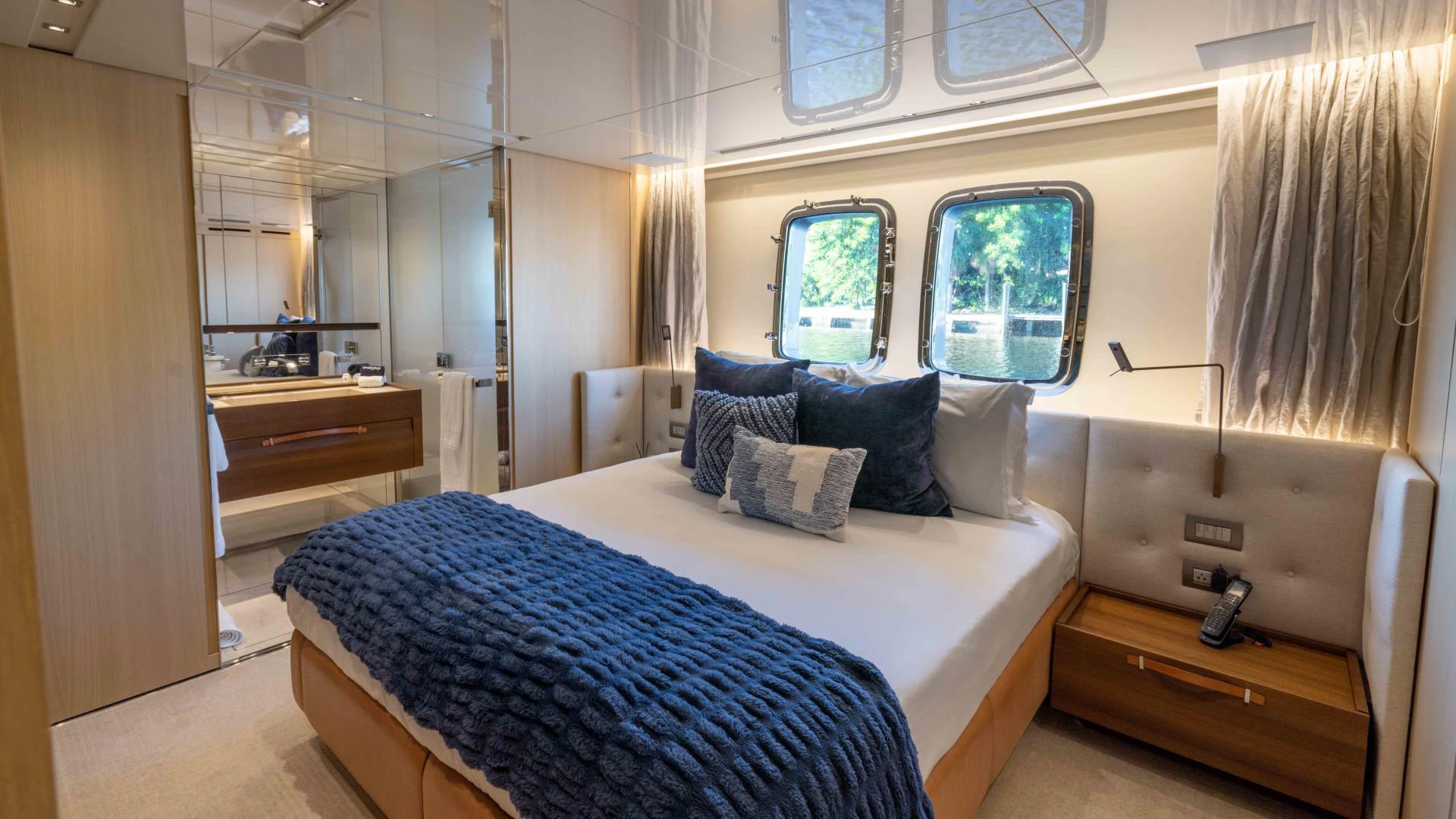 a bedroom with a bed and a desk aboard FREDDY Yacht for Sale