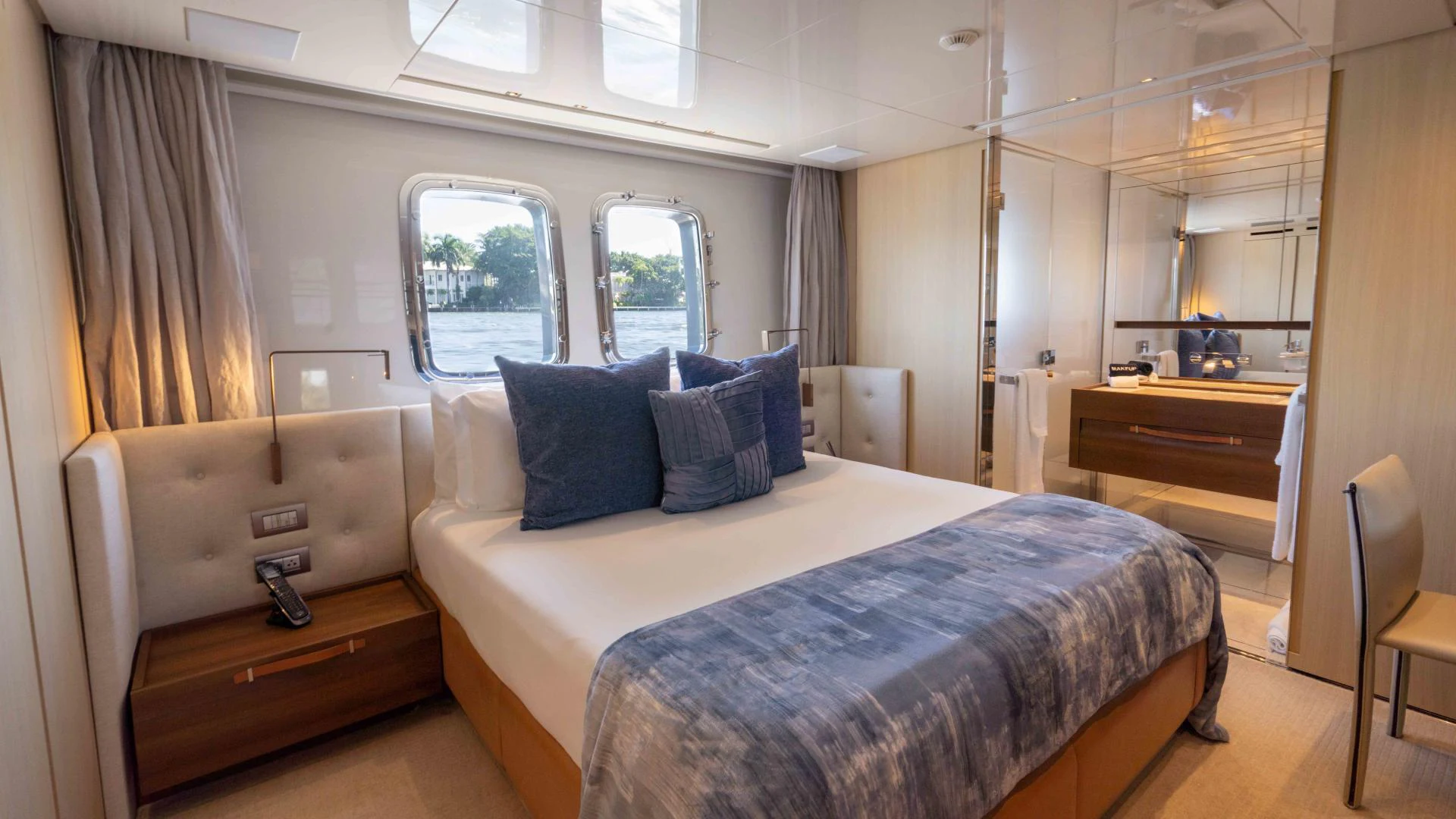 a bedroom with a bed and a dresser aboard FREDDY Yacht for Sale