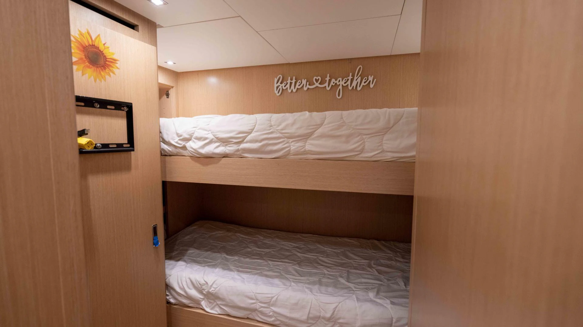 a room with a bed and a mirror aboard FREDDY Yacht for Sale