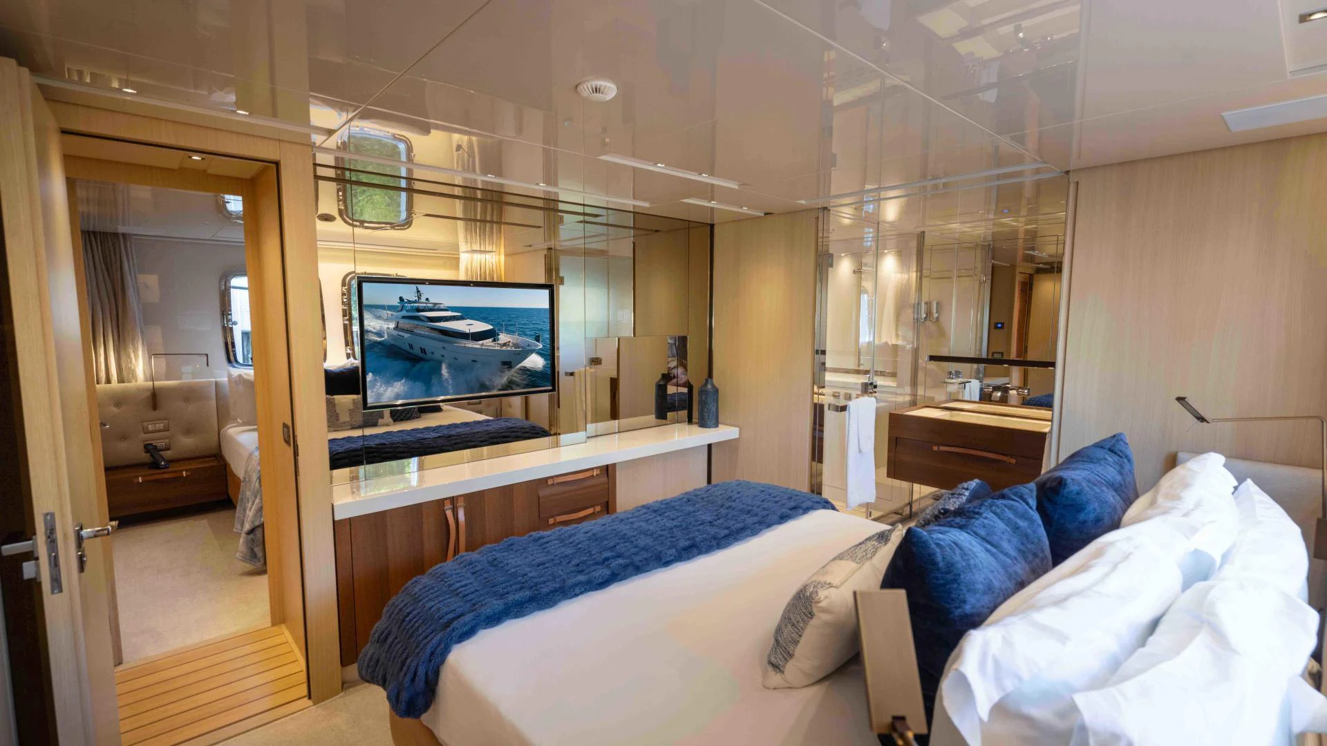 a bedroom with a bed and a television aboard FREDDY Yacht for Sale