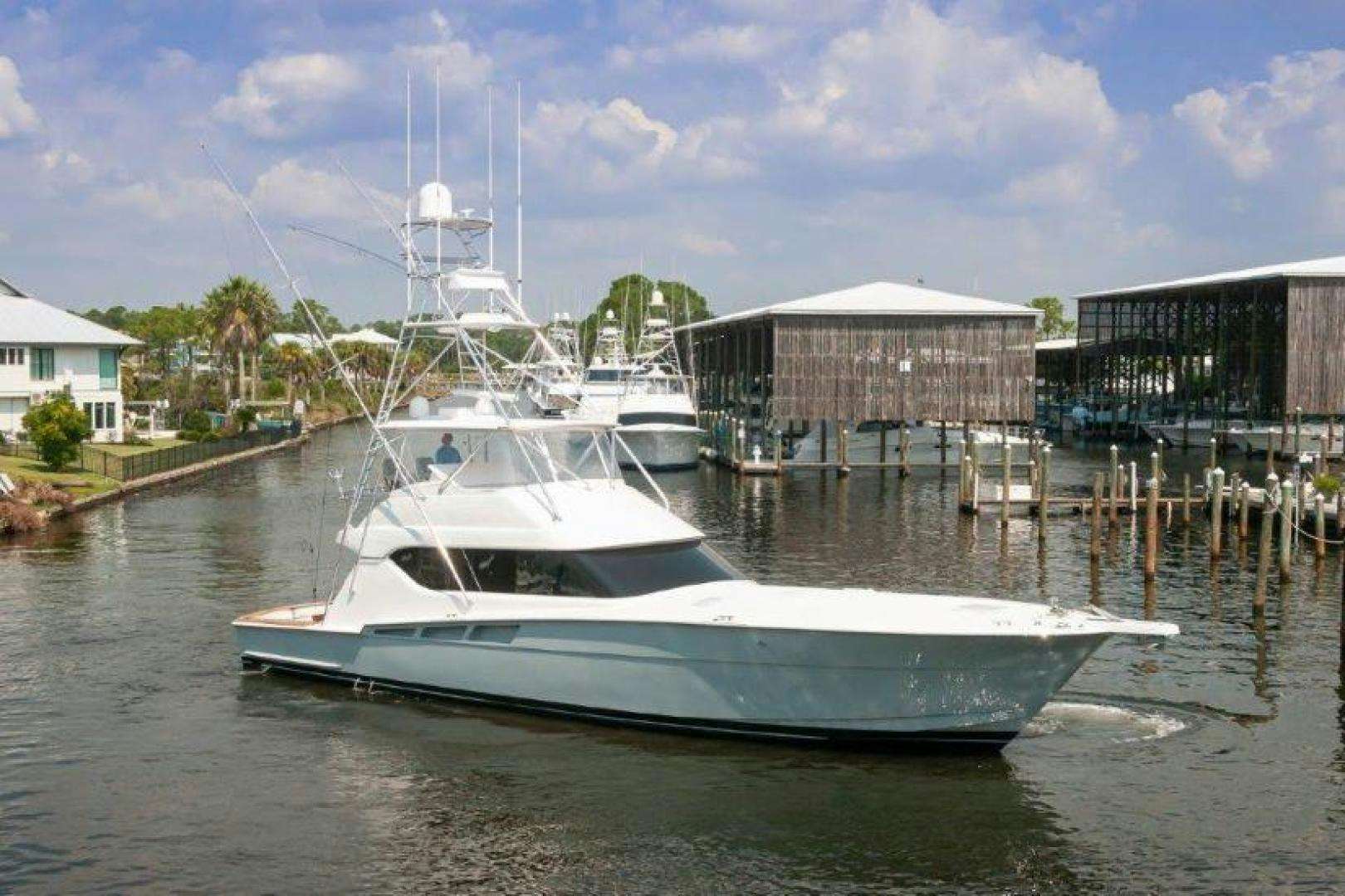 a boat docked at a pier aboard MISS MA'AM Yacht for Sale