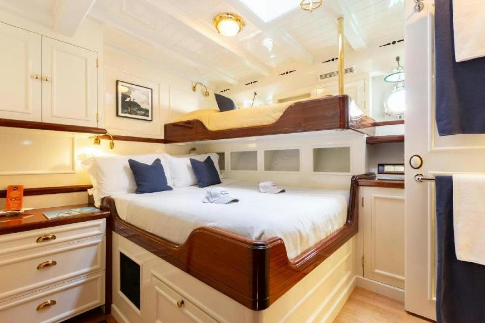 a bed in a room aboard NAEMA Yacht for Sale