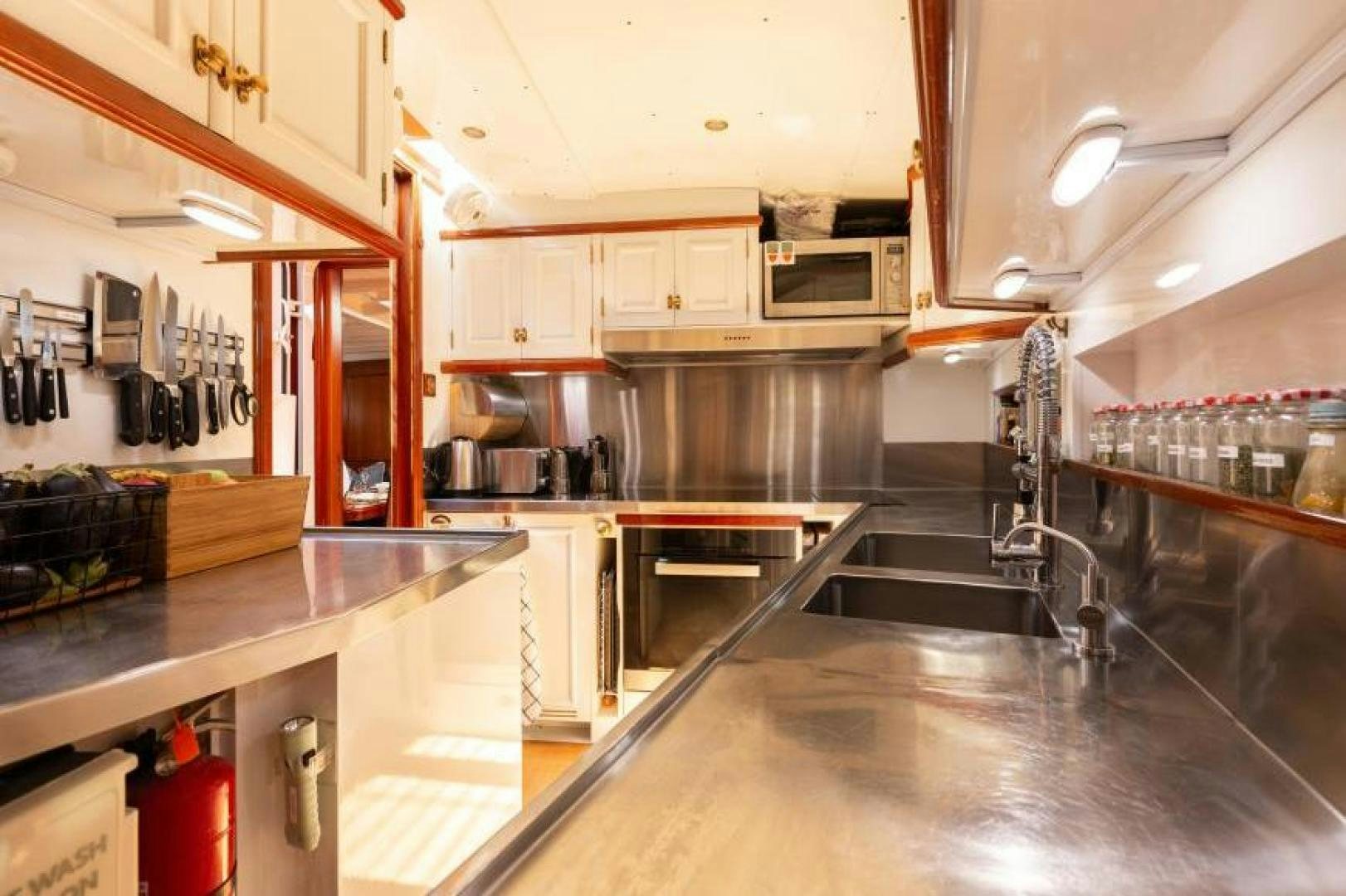 a kitchen with a large island aboard NAEMA Yacht for Sale