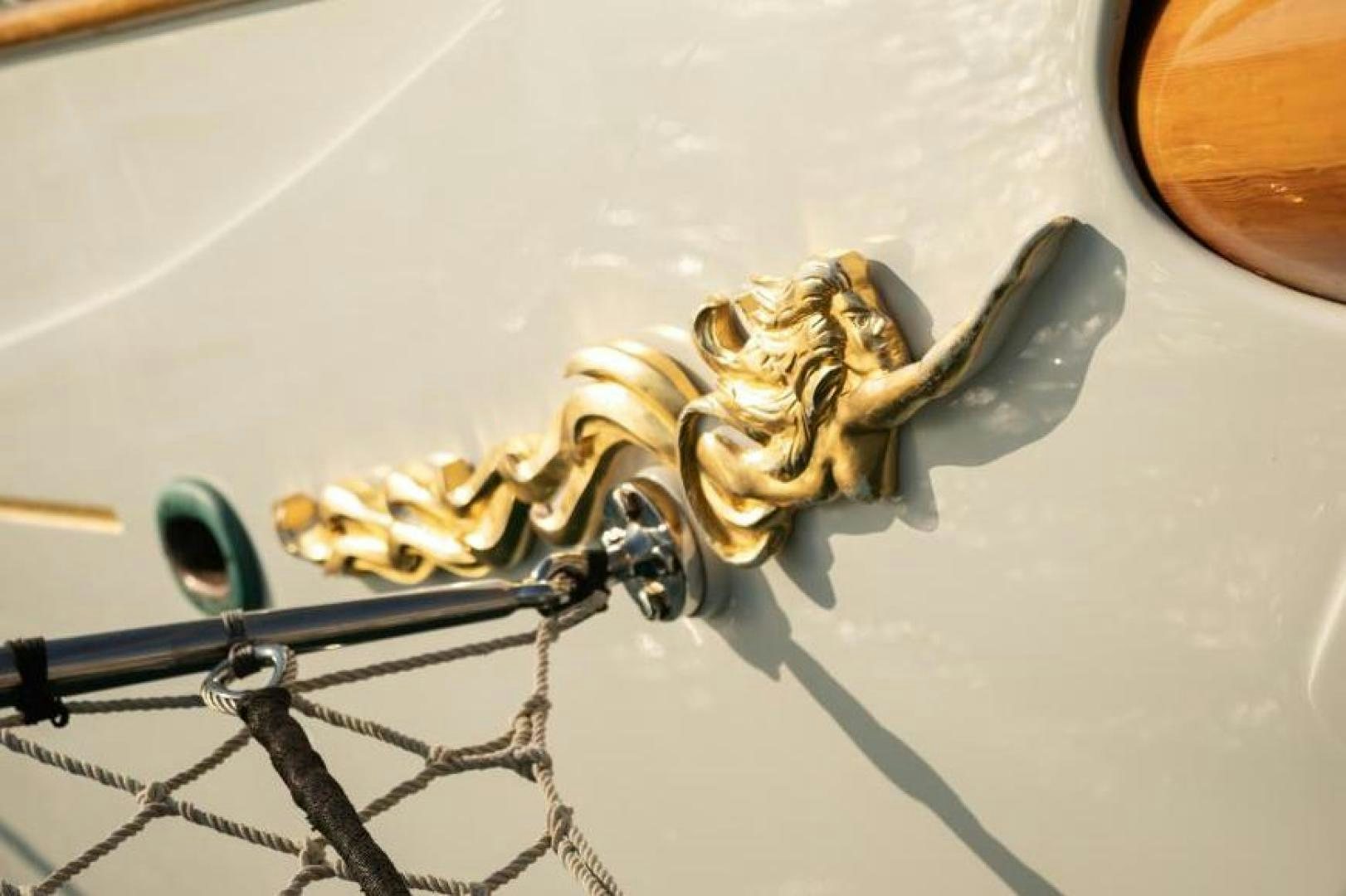 a gold chain on a white surface aboard NAEMA Yacht for Sale