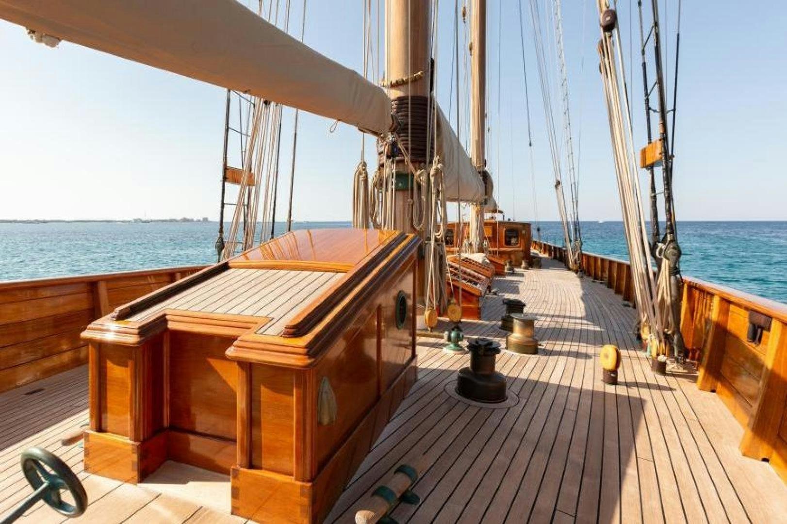 a deck with a deck and a boat on it aboard NAEMA Yacht for Sale