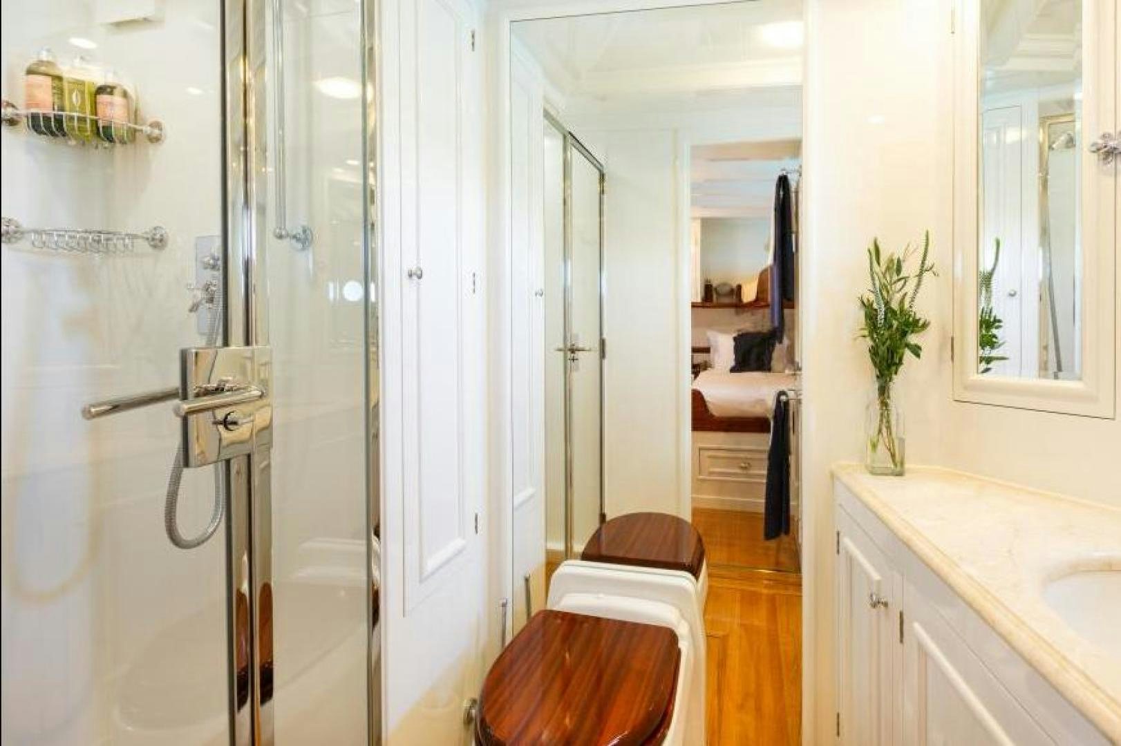 a bathroom with a sink and a mirror aboard NAEMA Yacht for Sale