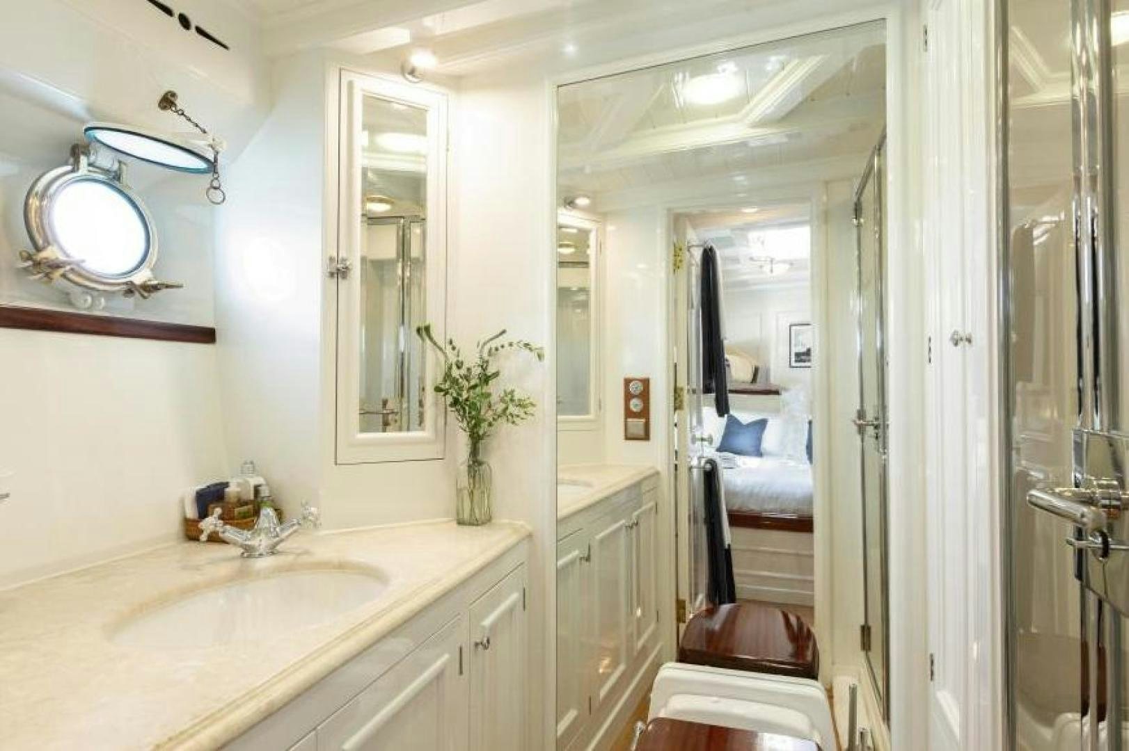 a bathroom with a sink and a mirror aboard NAEMA Yacht for Sale