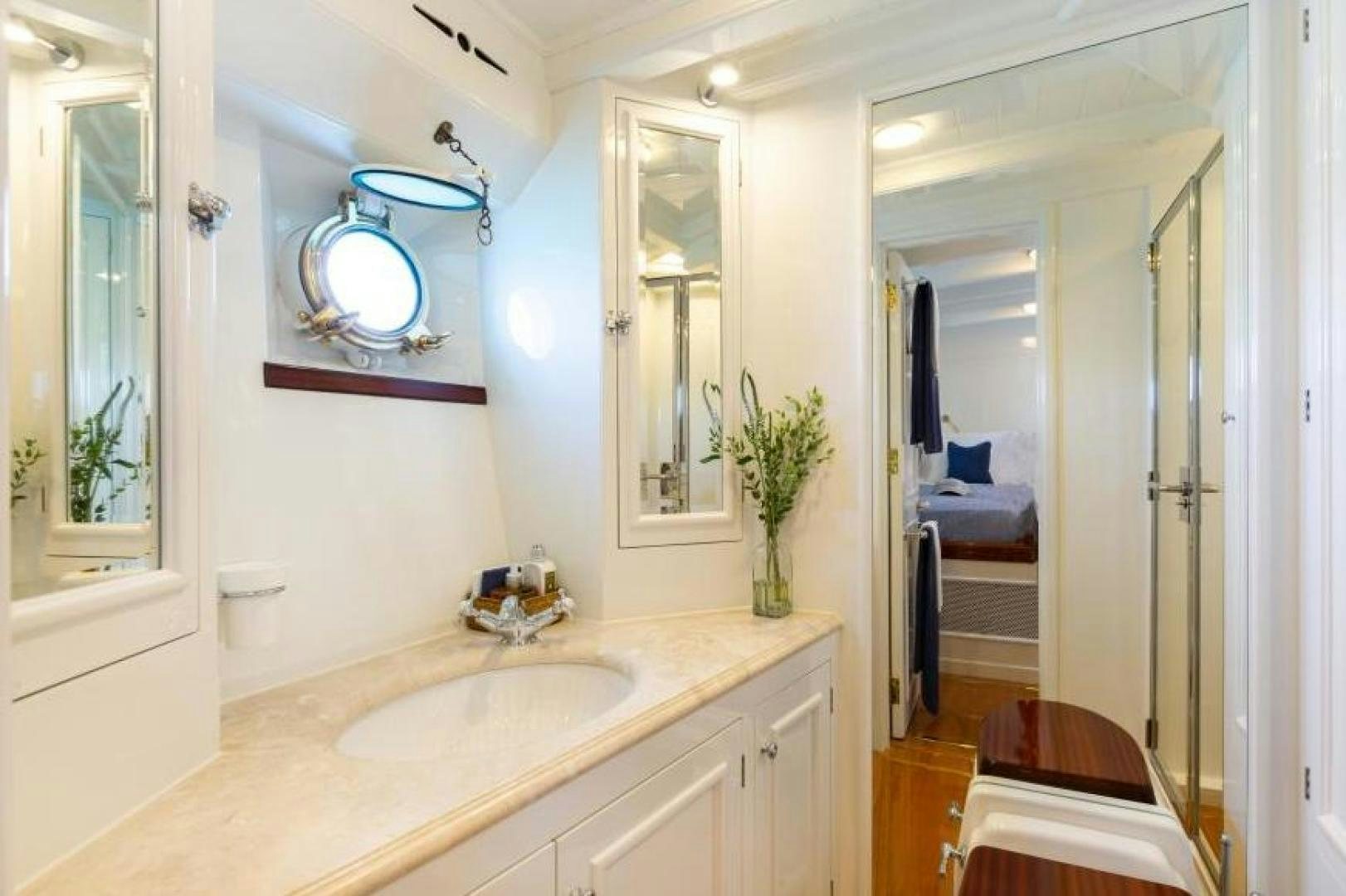 a bathroom with a sink and a mirror aboard NAEMA Yacht for Sale