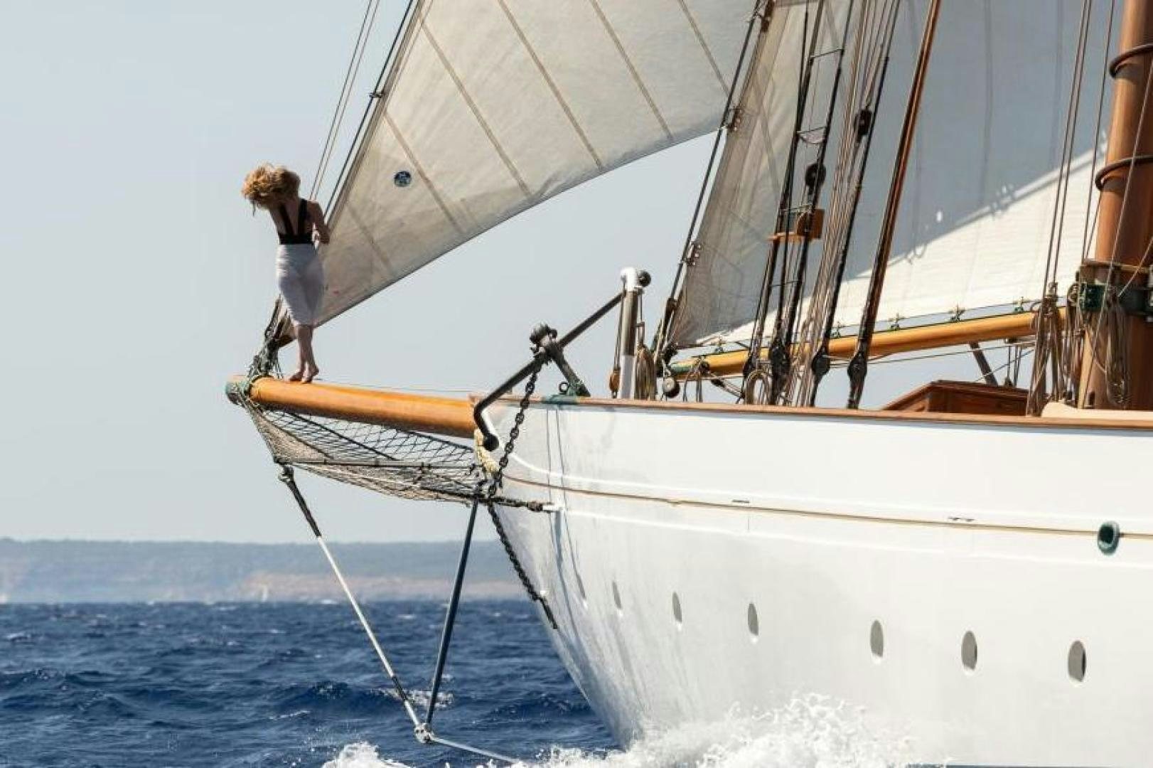 a person standing on a sailboat aboard NAEMA Yacht for Sale