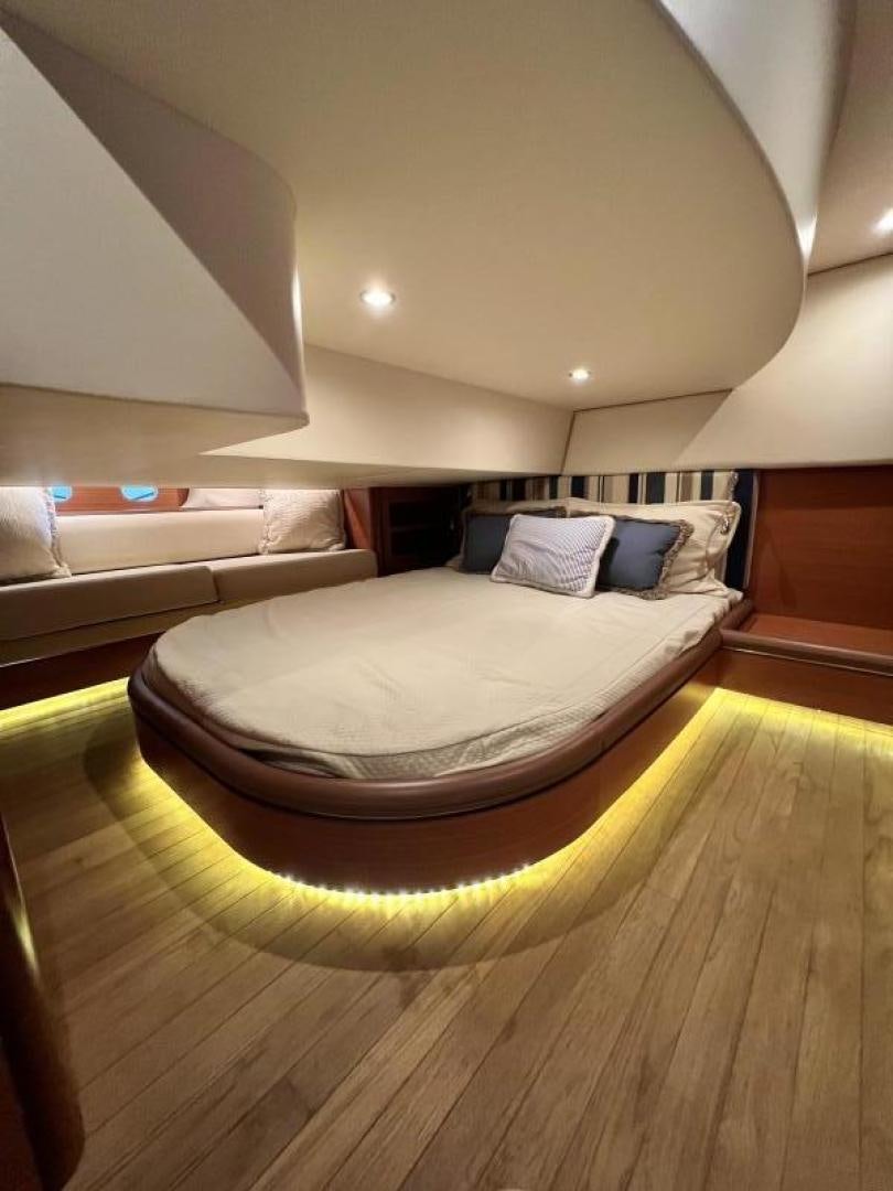 a bed in a room aboard BEYOND INFINITY Yacht for Sale