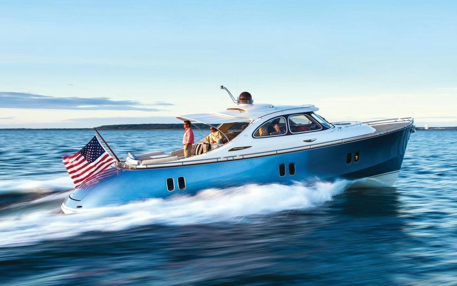 a boat with a flag on the front aboard BEYOND INFINITY Yacht for Sale