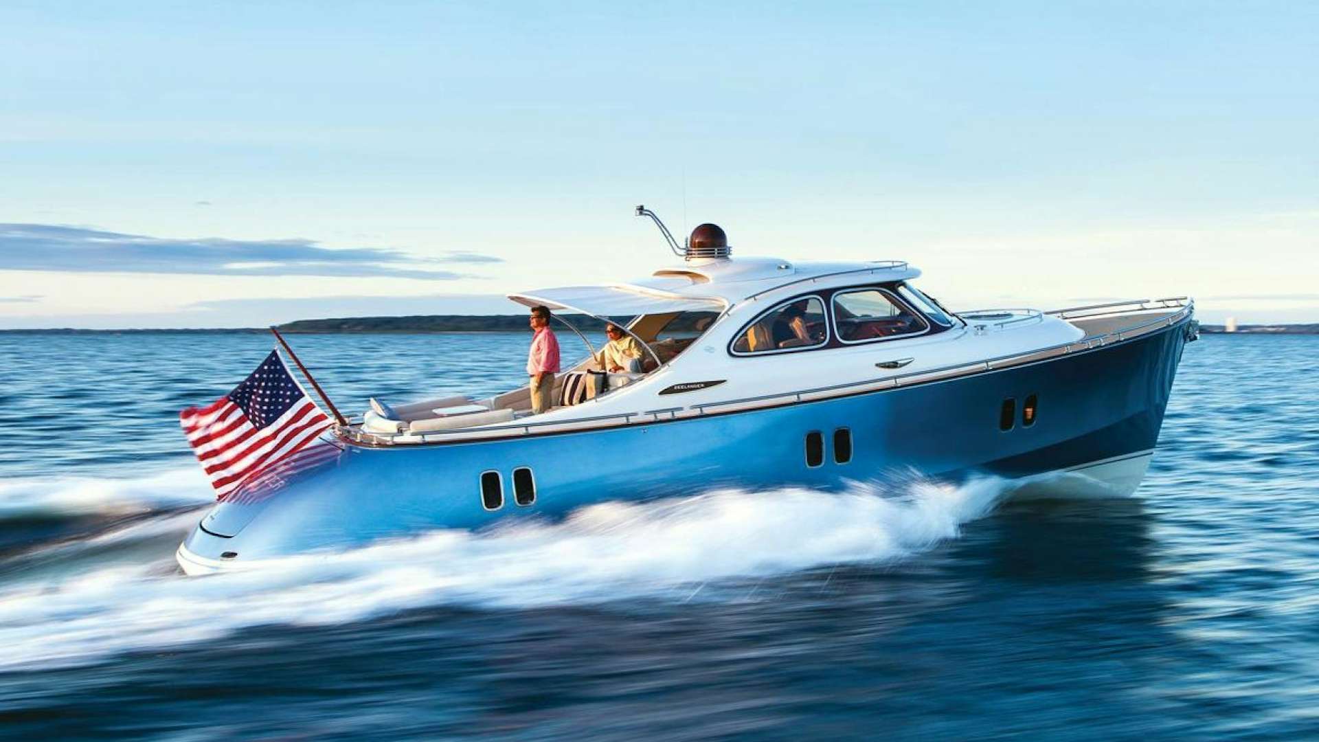 a boat with a flag on the front aboard BEYOND INFINITY Yacht for Sale