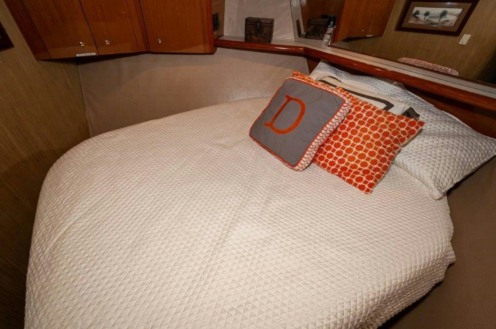 a bed with pillows aboard MISS PAULA V Yacht for Sale