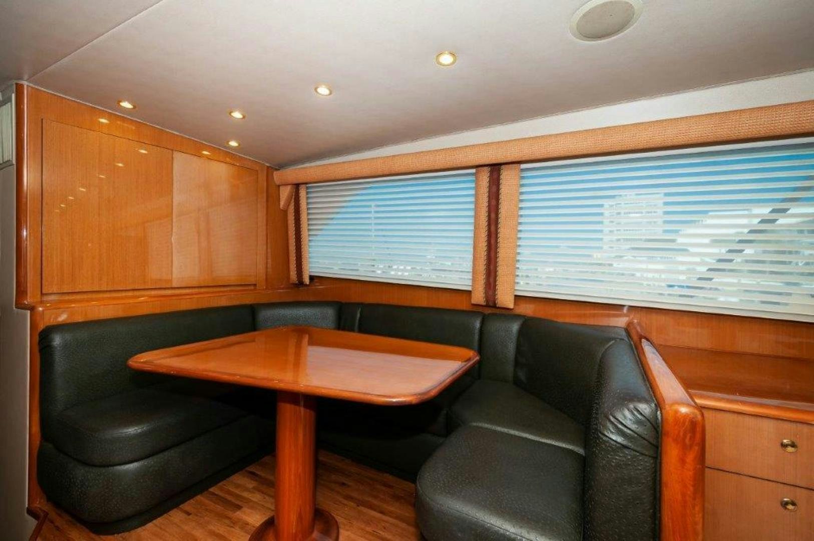 a room with a couch and a table aboard MISS PAULA V Yacht for Sale