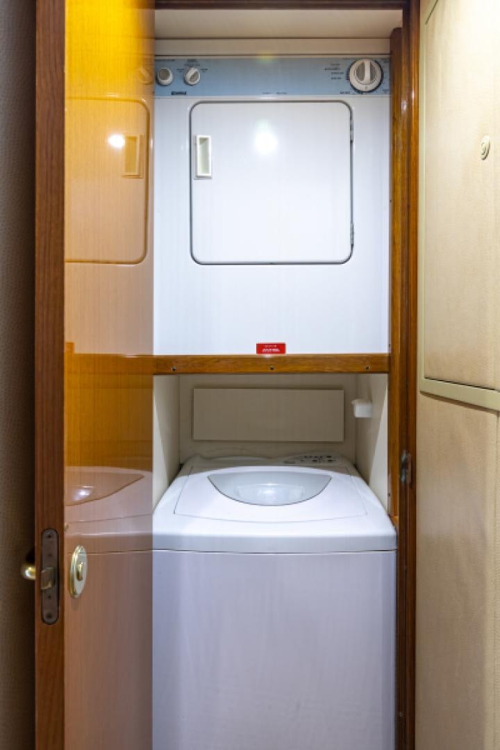 a washer and dryer in a bathroom aboard MISS PAULA V Yacht for Sale