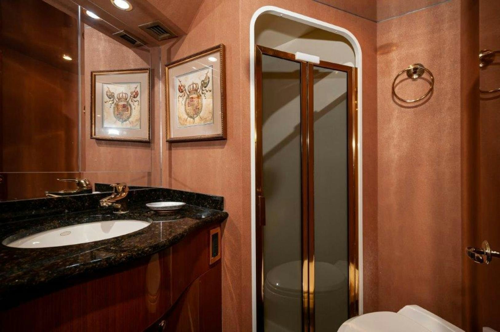 a bathroom with a glass shower aboard MISS PAULA V Yacht for Sale