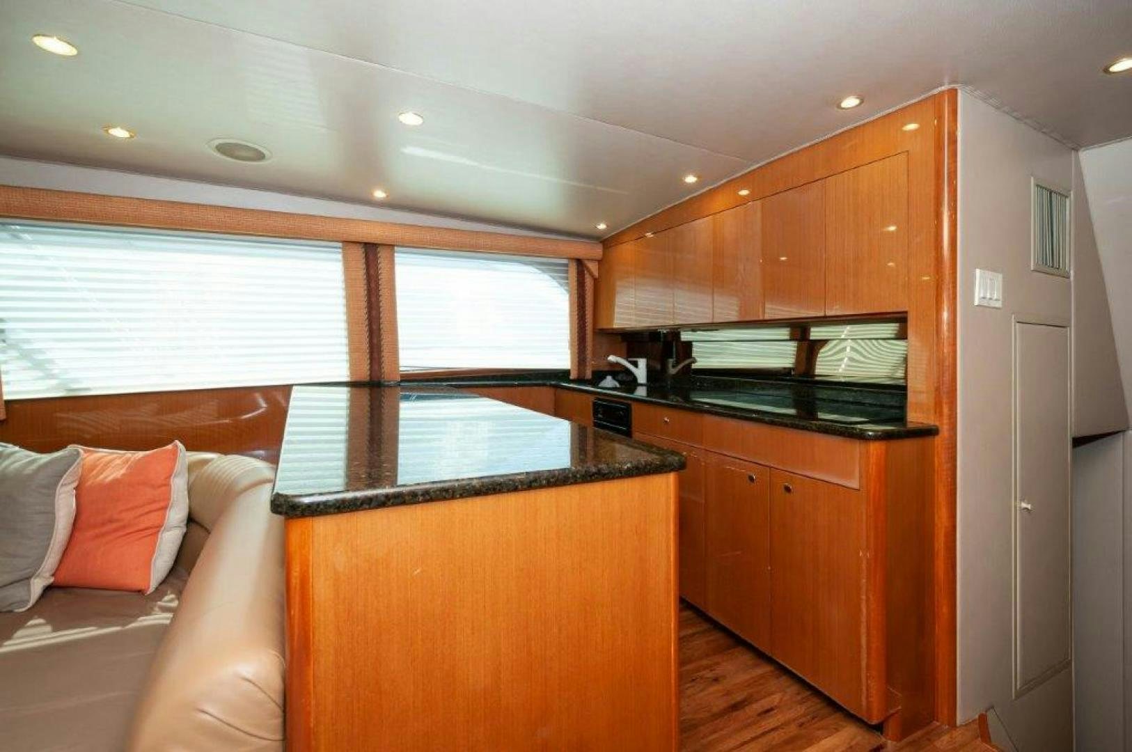 a room with a bed and a microwave aboard MISS PAULA V Yacht for Sale
