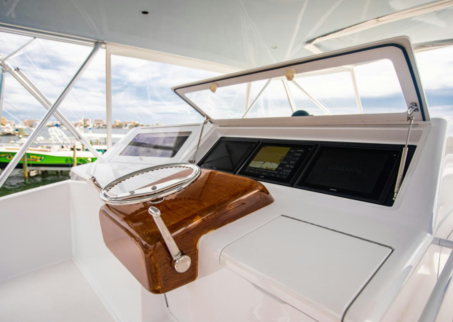 a hand holding a brown leather glove aboard MISS PAULA V Yacht for Sale