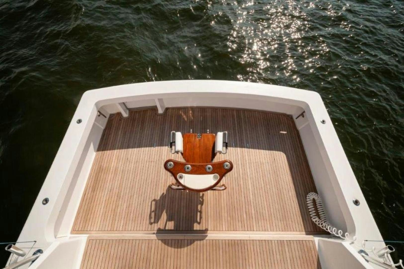 a boat with a steering wheel aboard MISS PAULA V Yacht for Sale